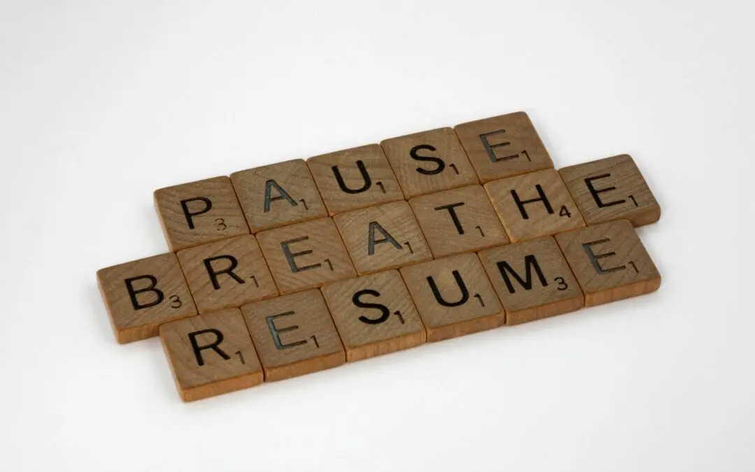 Scrabble tiles spelling pause, breathe, resume