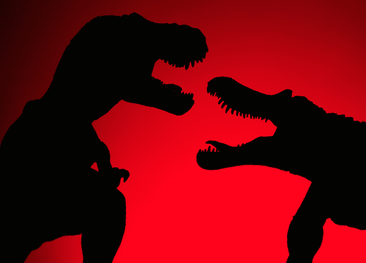 Dinosaur silhouette on red background